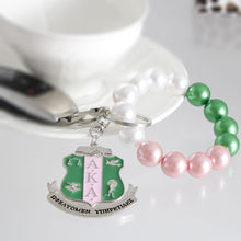 Load image into Gallery viewer, Pink Green Pearl Shield Keychain
