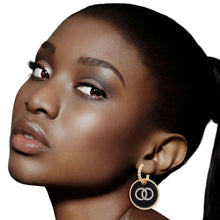 Load image into Gallery viewer, Black Infinity Charm Twisted Gold Hoops
